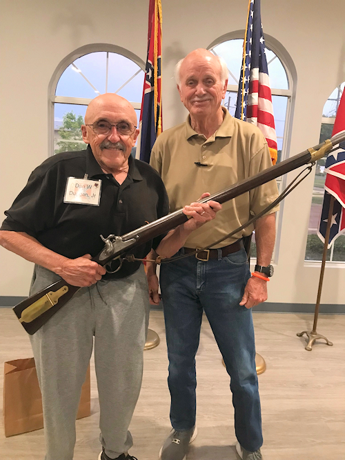 Dan Duggan, Jr., a member of the MOSB in Brandon, MS shows his authentic Mississippi Rifle used by the Mississippi Riflemen under the command of Col Jefferson Davis in the war with Mexico to SCV Commander Sandy Jackson in Madison, MS recently.